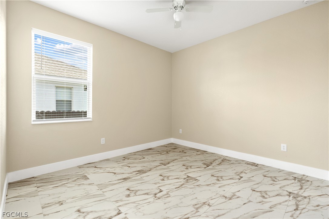 2919 23rd Street Southwest Lehigh Acres, FL 33976 - Photo 13 of 17 a view of a room with a window