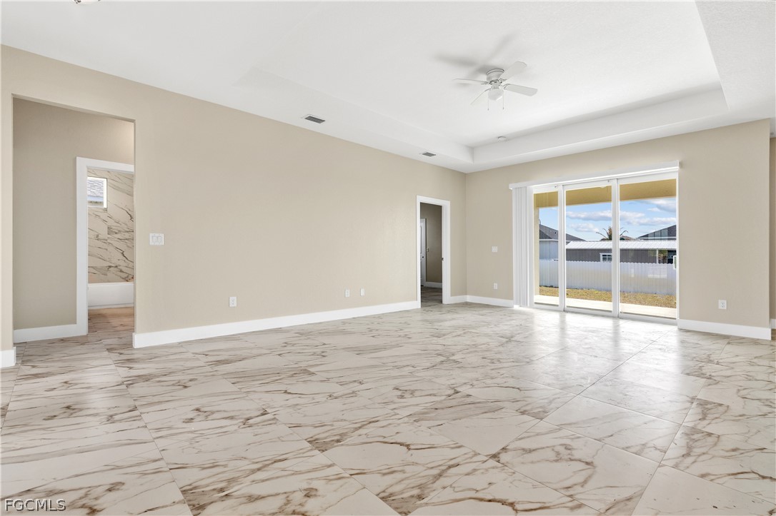 2919 23rd Street Southwest Lehigh Acres, FL 33976 - Photo 3 of 17 a view of an empty room with a window