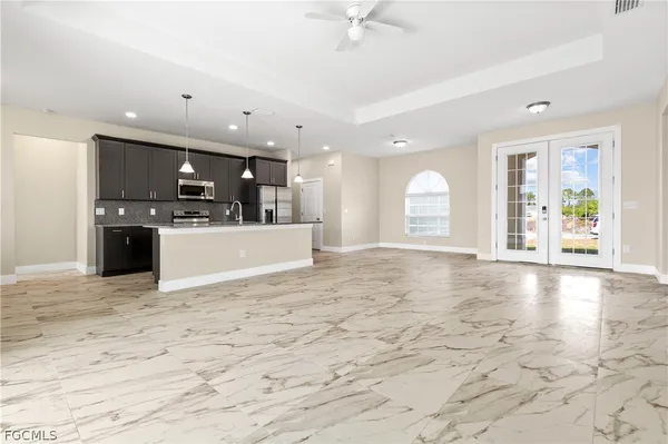 a view of a kitchen with a sink and a stove top oven