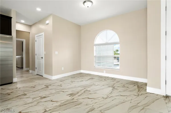 a view of an empty room and window