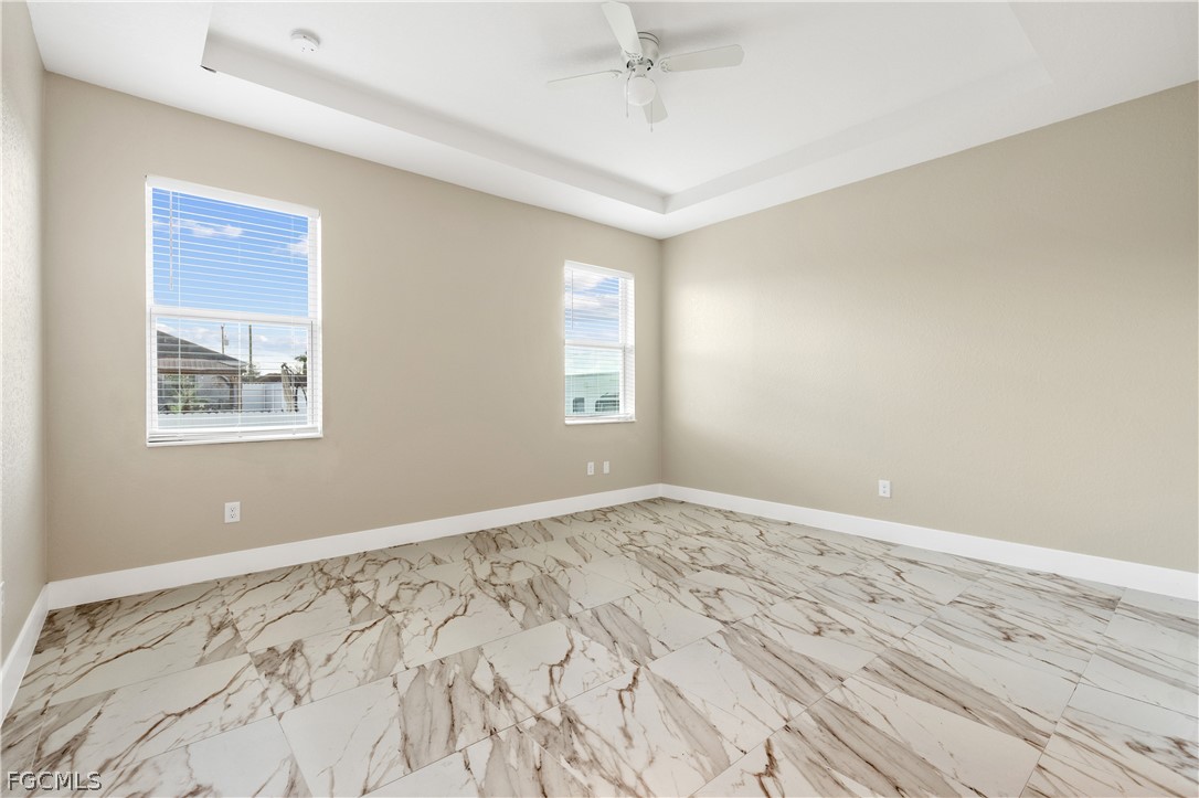 2919 23rd Street Southwest Lehigh Acres, FL 33976 - Photo 7 of 17 a view of empty room with wooden floor