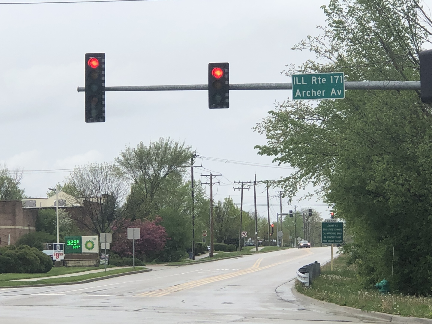 13815 McCarthy Road Lemont, IL 60439 - Photo 4 of 8 a street sign on a sidewalk next to a road