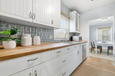 a kitchen with a stove and a refrigerator