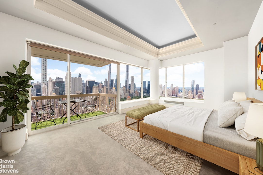 200 East 69th Street, Unit 47 Manhattan, NY 10021 - Photo 11 of 30 a spacious bedroom with a large bed and a large window