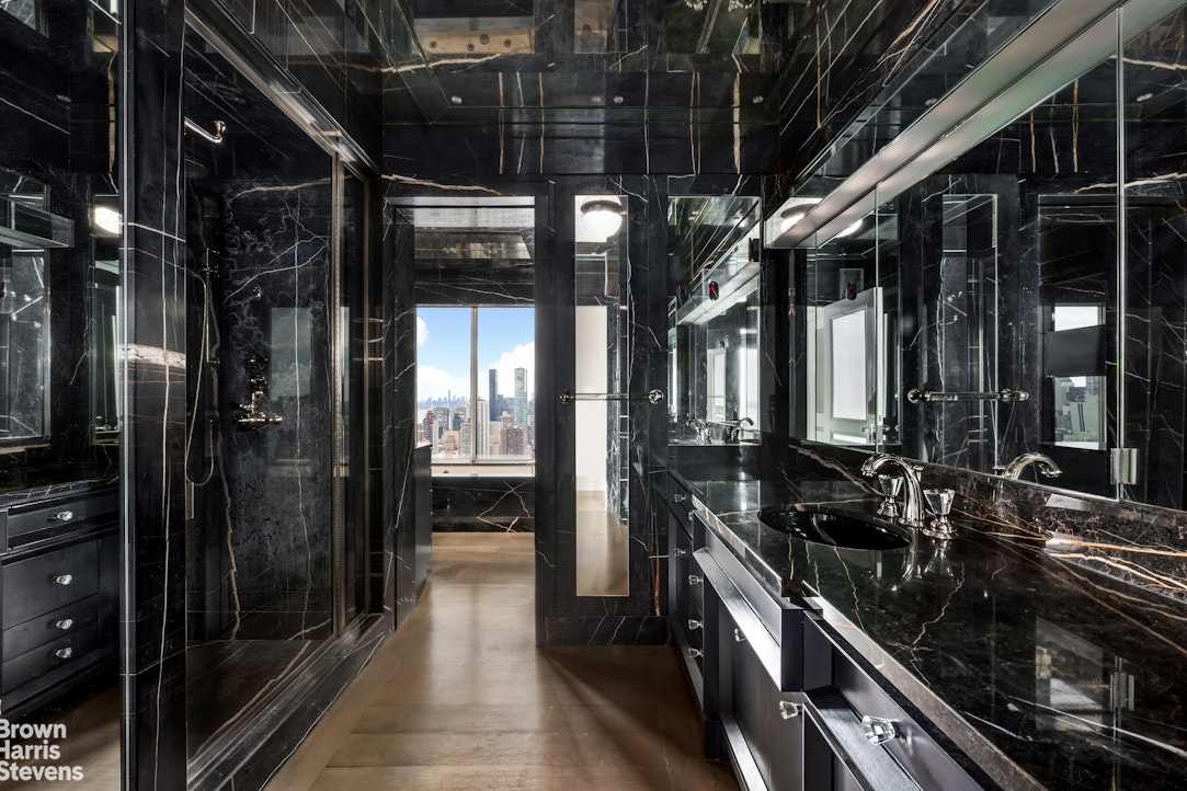 200 East 69th Street, Unit 47 Manhattan, NY 10021 - Photo 13 of 30 a city view with tall glass windows