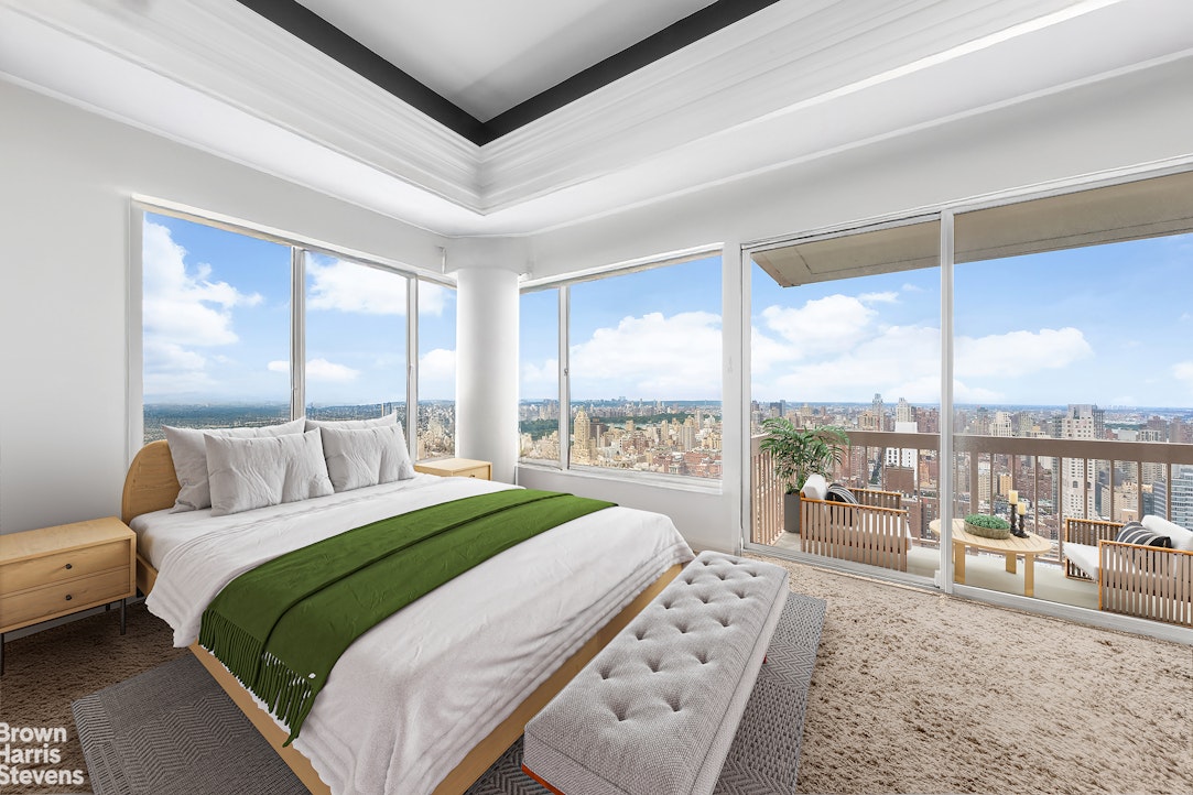 200 East 69th Street, Unit 47 Manhattan, NY 10021 - Photo 17 of 30 a bedroom with a large bed and a large window