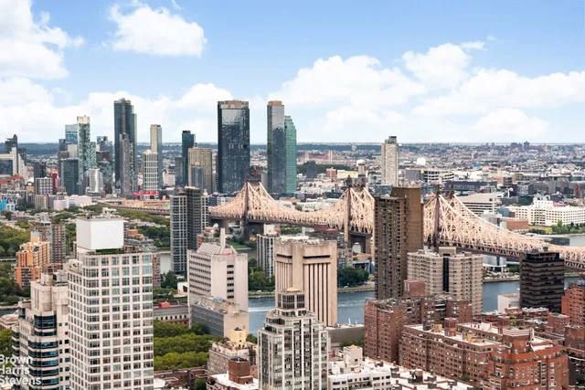 a spacious bedroom with a large window and a bed