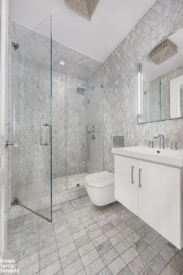 200 East 69th Street, Unit 47 Manhattan, NY 10021 - Photo 22 of 30 a bathroom with a sink toilet and shower