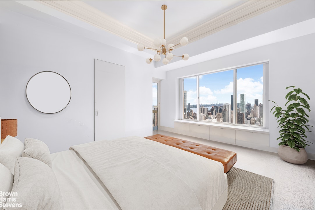 200 East 69th Street, Unit 47 Manhattan, NY 10021 - Photo 23 of 30 a bedroom with bed and a large window
