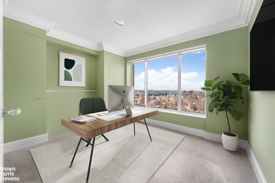 200 East 69th Street, Unit 47 Manhattan, NY 10021 - Photo 28 of 30 a view of a livingroom with furniture and a window