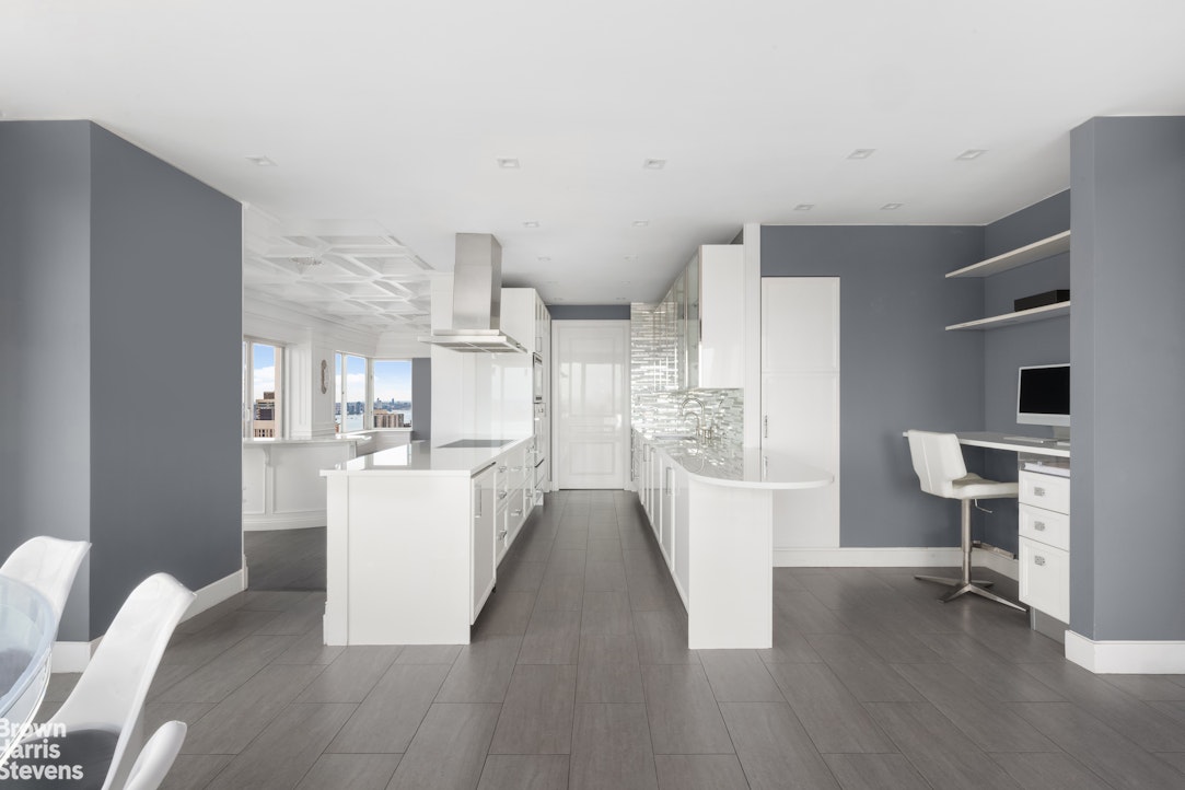 200 East 69th Street, Unit 47 Manhattan, NY 10021 - Photo 5 of 30 a view of kitchen with furniture and wooden floor