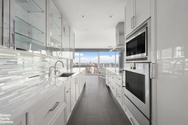 a view of kitchen with furniture and wooden floor