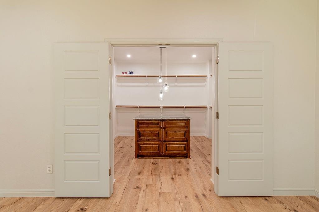 280 Lanier Road Combine, TX 75159 - Photo 12 of 36 wooden floor in an empty room and a kitchen