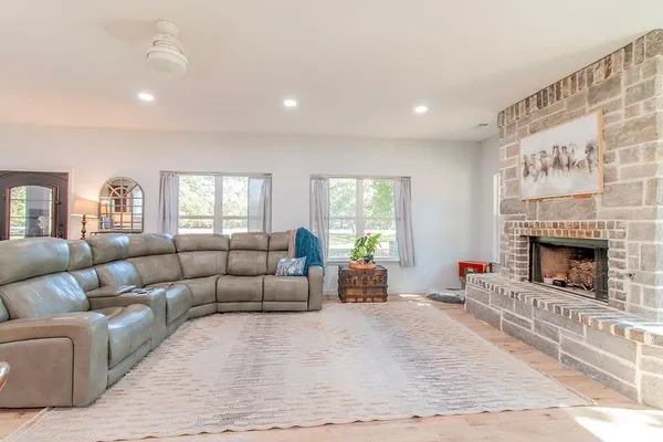 a living room with furniture and a fireplace