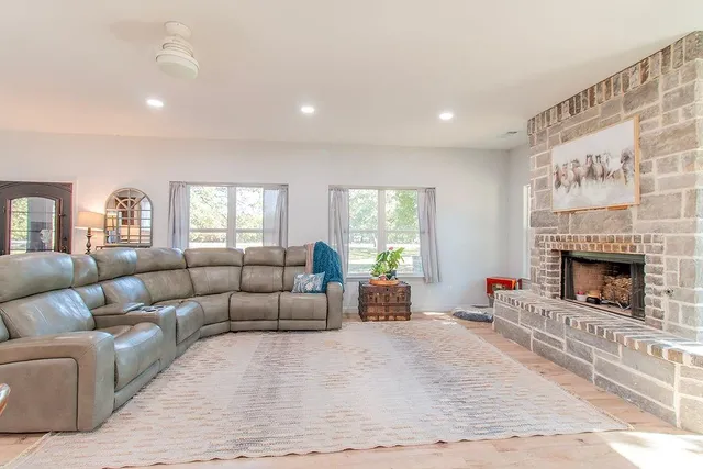 a living room with furniture and a fireplace