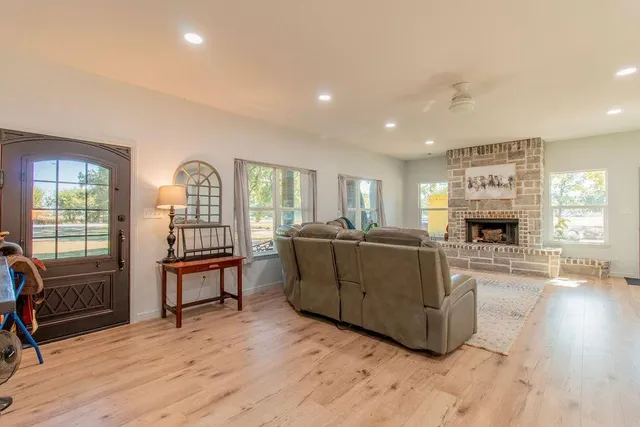 a kitchen with sink cabinets and wooden floor