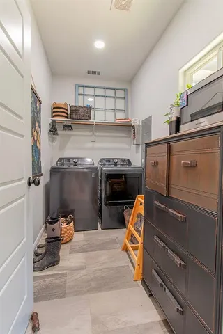 a bed room with a bed and a chair