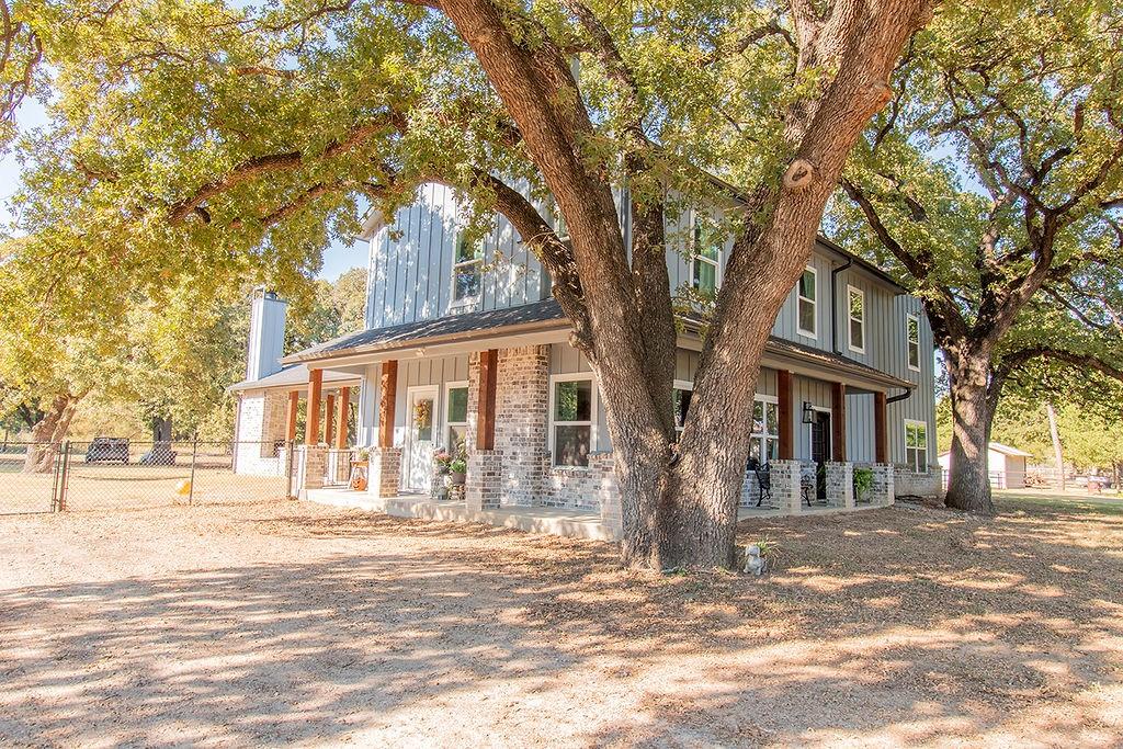 280 Lanier Road Combine, TX 75159 - Photo 2 of 36 a front view of a house with a trees