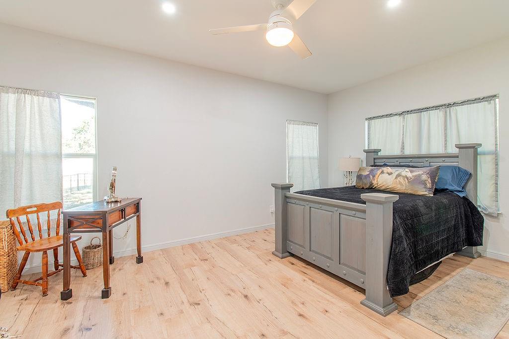 280 Lanier Road Combine, TX 75159 - Photo 21 of 36 a bed room with a bed and a chair