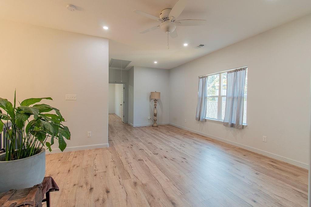 280 Lanier Road Combine, TX 75159 - Photo 27 of 36 a view of an empty room with wooden floor and a window