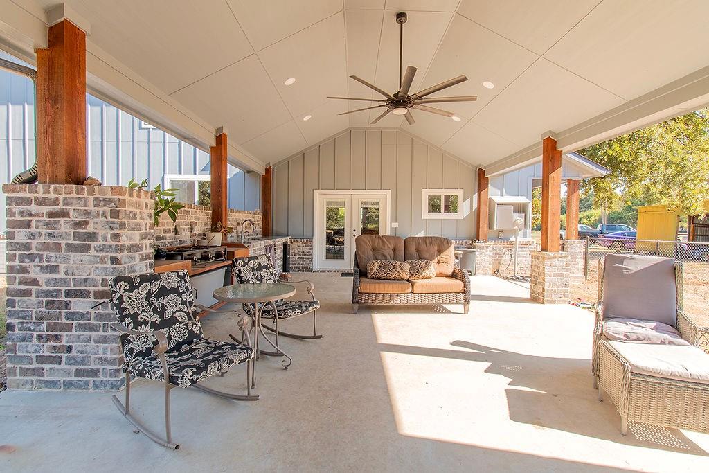 280 Lanier Road Combine, TX 75159 - Photo 34 of 36 a living room with fireplace furniture and a large window