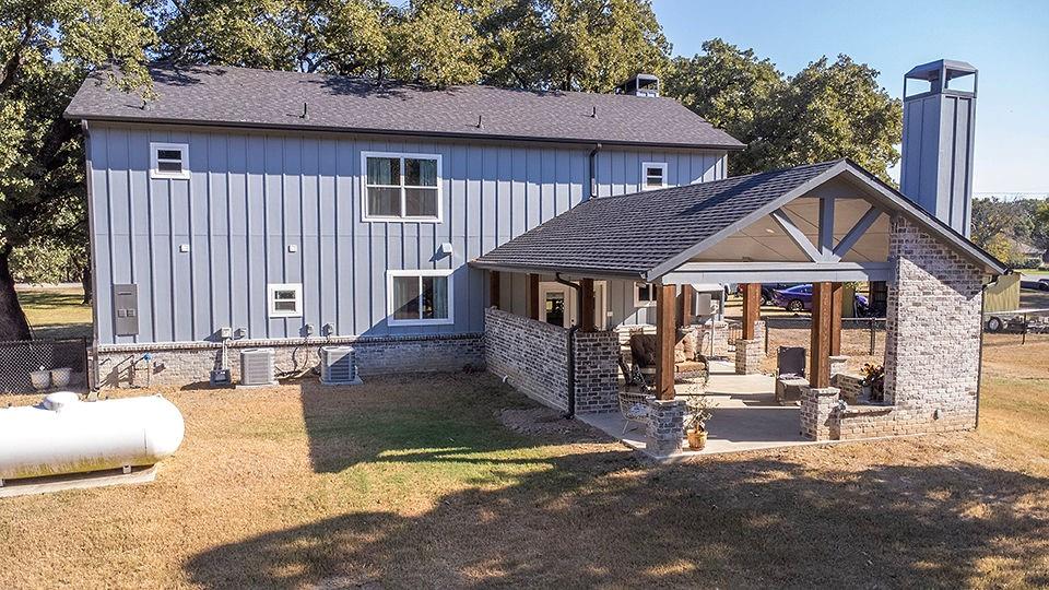 280 Lanier Road Combine, TX 75159 - Photo 4 of 36 a view of a house with wooden walls and floor to ceiling windows