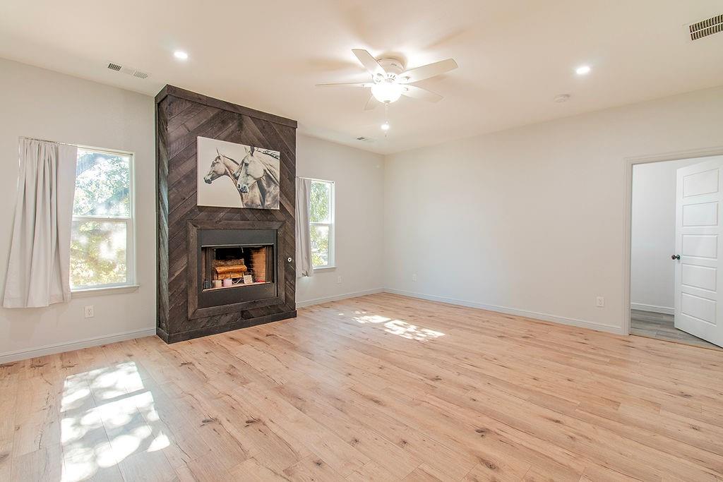280 Lanier Road Combine, TX 75159 - Photo 8 of 36 a view of empty room with window and fireplace