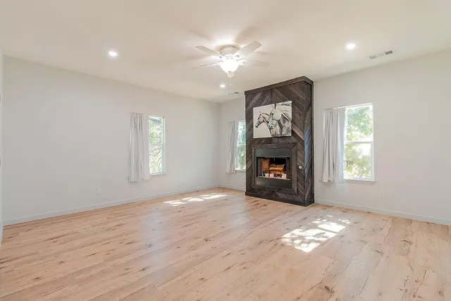 a spacious bathroom with a granite countertop sink and a mirror