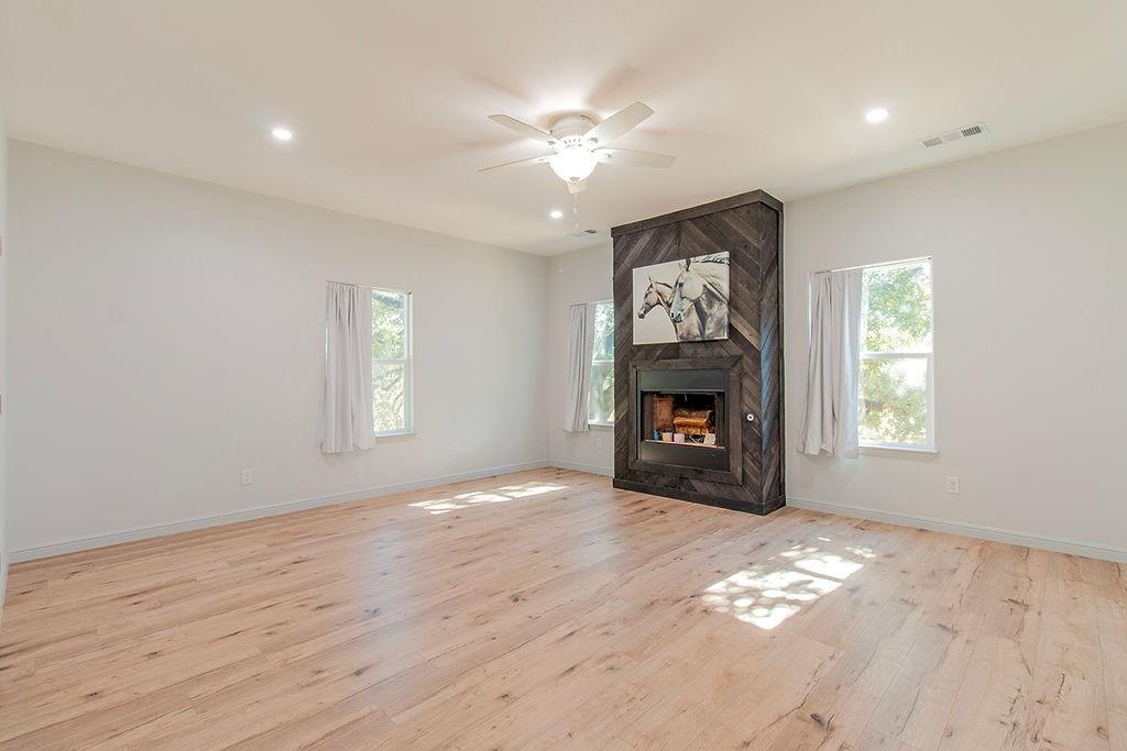 280 Lanier Road Combine, TX 75159 - Photo 9 of 36 a view of an empty room with a window and fireplace