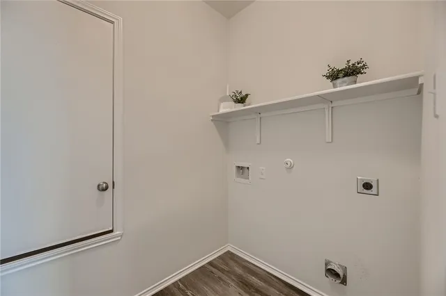 a view of a backyard with wooden fence