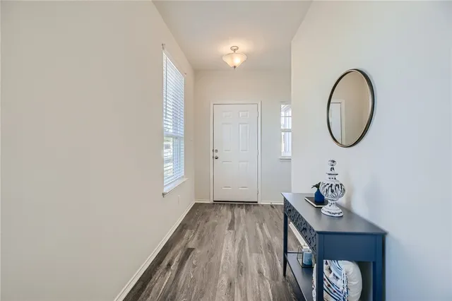 a view of a livingroom with furniture and wooden floor
