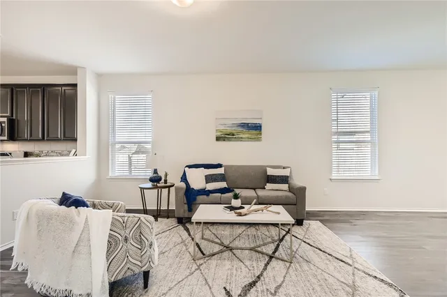 a living room with furniture and a window