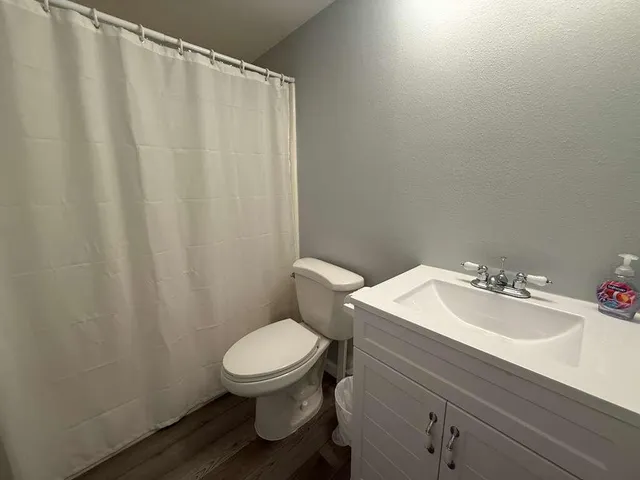 a view of a chairs and table in patio