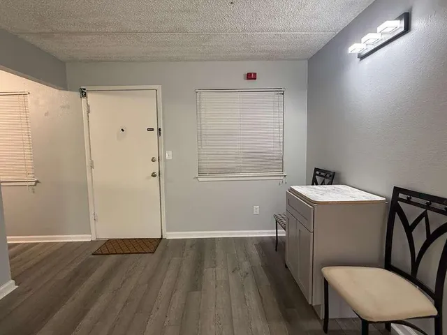 a bathroom with a sink mirror vanity and toilet