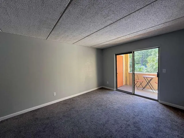 a kitchen that has a refrigerator and a sink