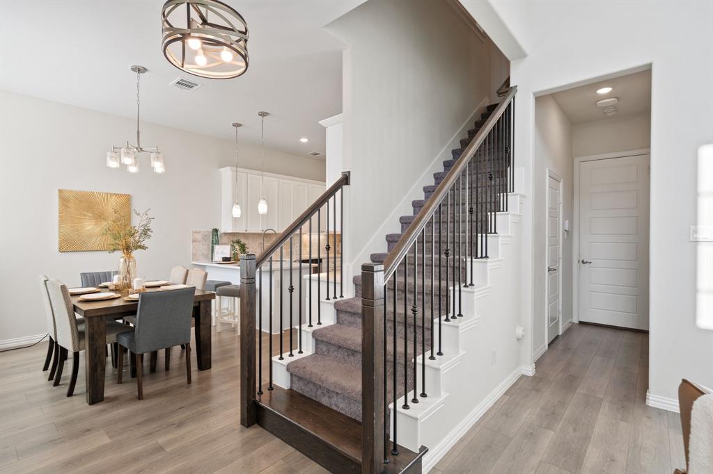 744 Patriot Lane Irving, TX 75060 - Photo 14 of 40 an entryway with a dining room and wooden floor