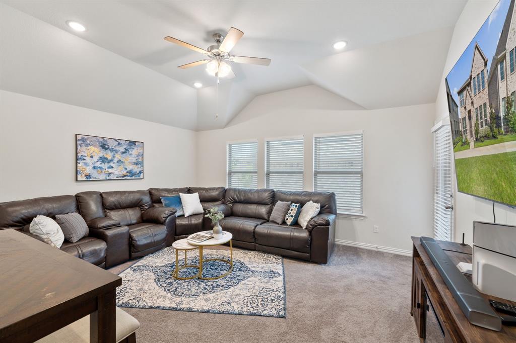 744 Patriot Lane Irving, TX 75060 - Photo 15 of 40 a living room with furniture and a chandelier