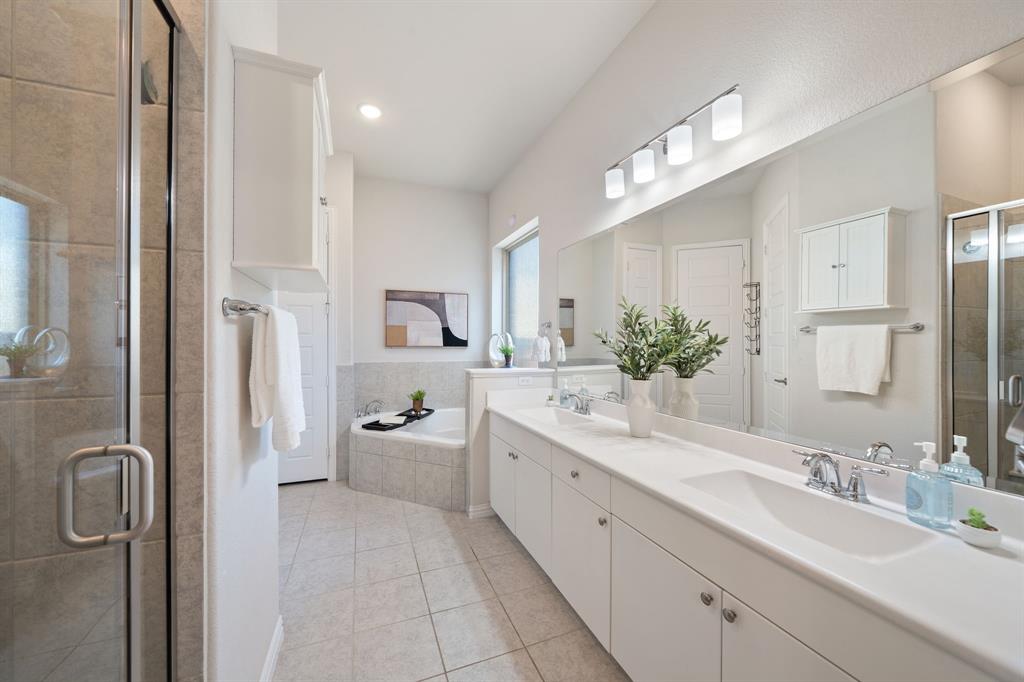 744 Patriot Lane Irving, TX 75060 - Photo 19 of 40 a large bathroom with a double vanity sink mirror double and shower