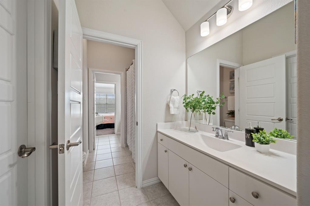 744 Patriot Lane Irving, TX 75060 - Photo 24 of 40 a bathroom with a sink and a mirror