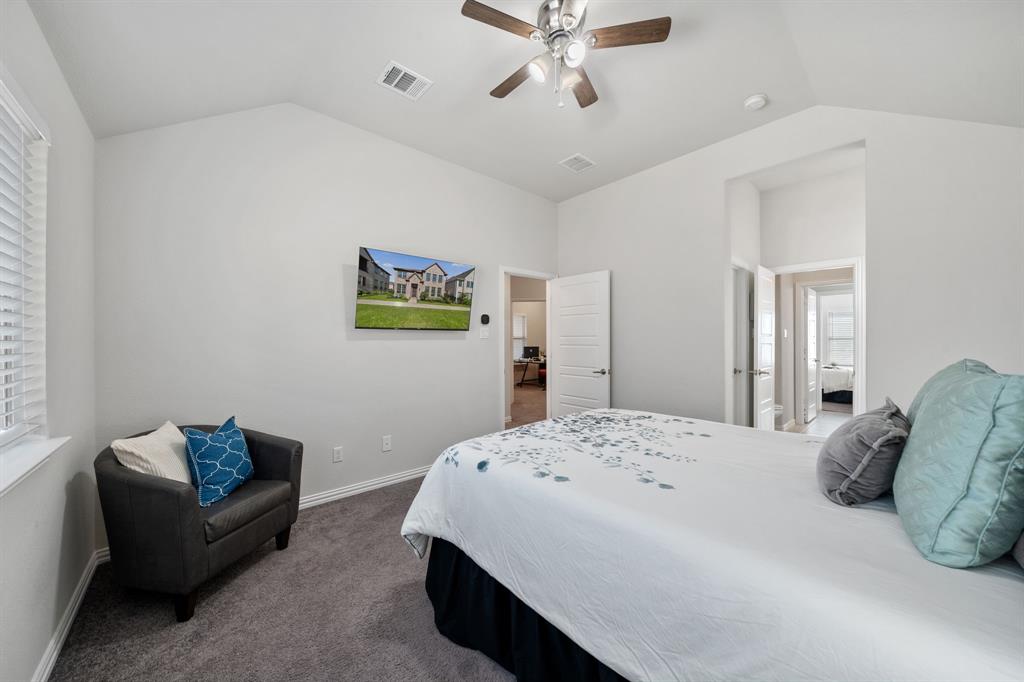 744 Patriot Lane Irving, TX 75060 - Photo 26 of 40 a bedroom with a bed couch and window