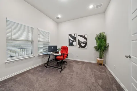 a workspace with furniture and a window