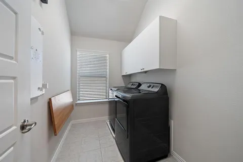 a view of livingroom with washer and dryer