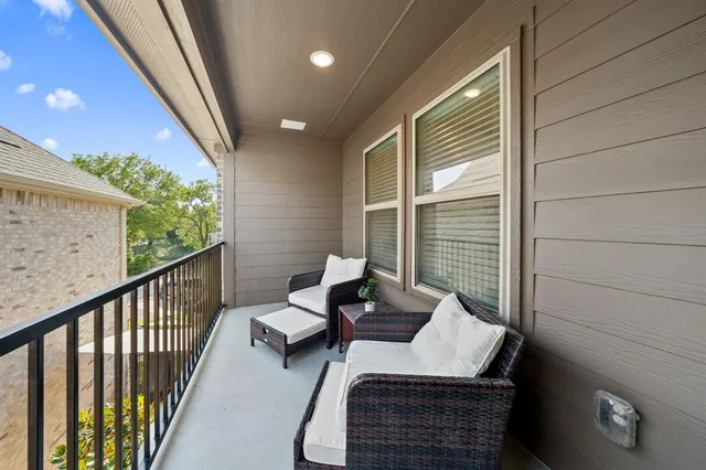 a view of balcony with furniture