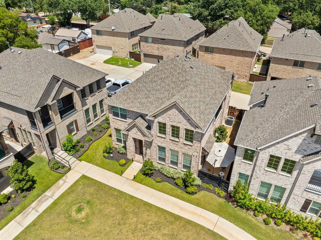 744 Patriot Lane Irving, TX 75060 - Photo 38 of 40 an aerial view of a house with a swimming pool and outdoor seating