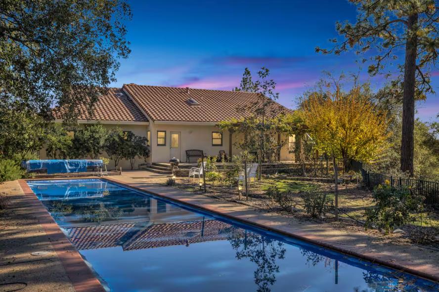 a view of house with outdoor seating