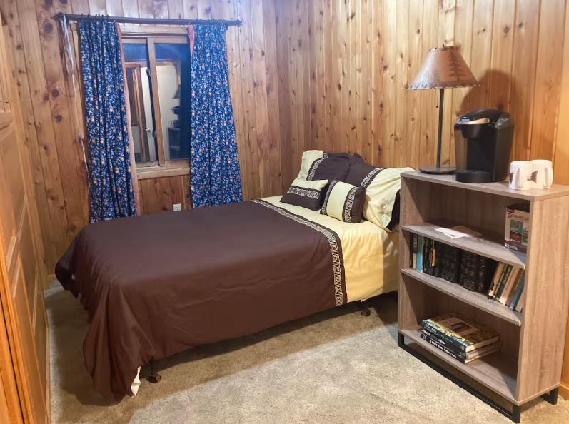 22707 Upton Road Plymouth, CA 95669 - Photo 15 of 26 a bedroom with a bed and a table