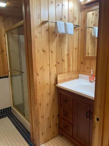 a bathroom with a toilet and a shower curtain