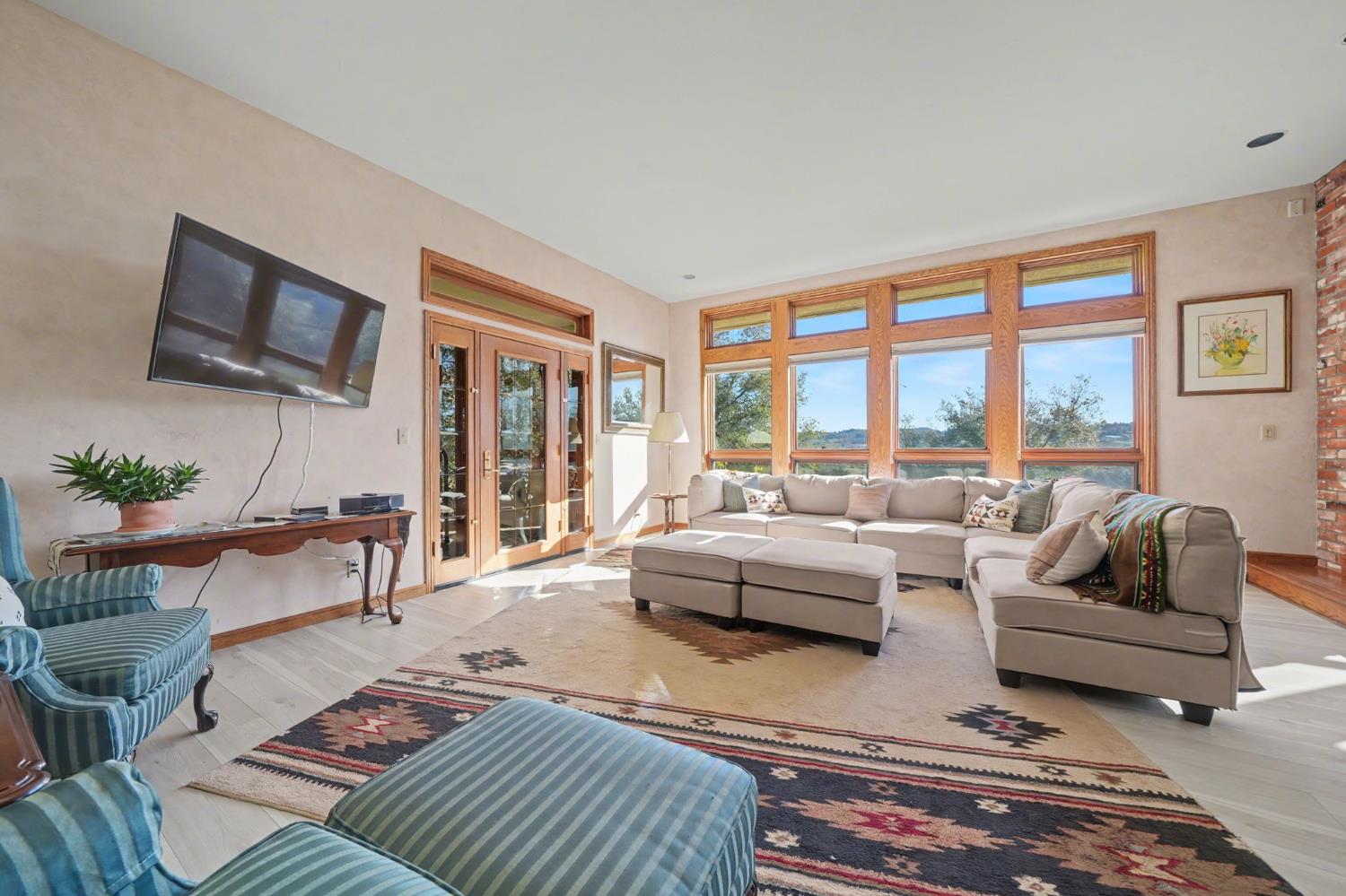 22707 Upton Road Plymouth, CA 95669 - Photo 21 of 99 a living room with furniture and a flat screen tv