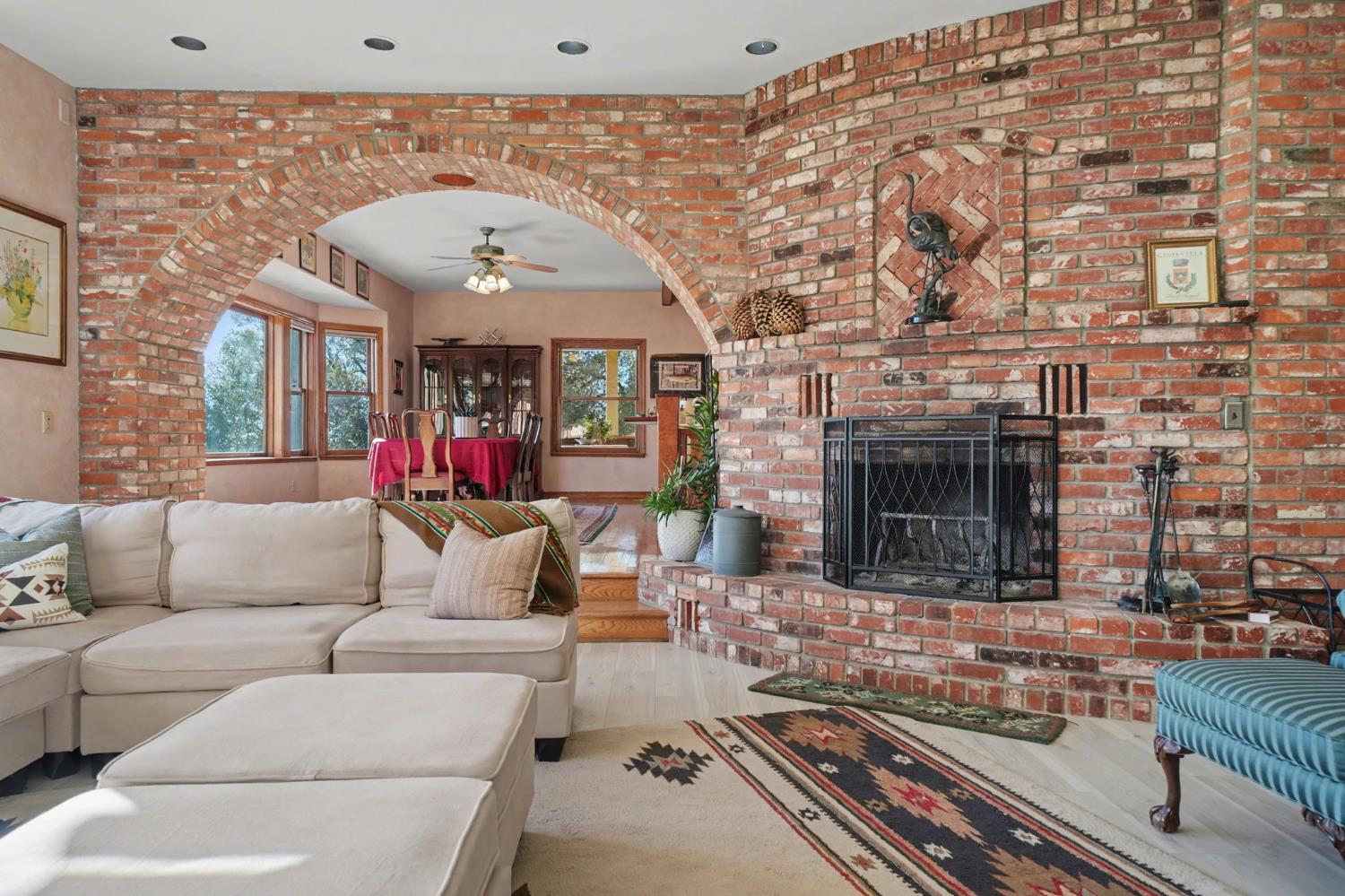 22707 Upton Road Plymouth, CA 95669 - Photo 24 of 99 a living room with furniture and a fireplace
