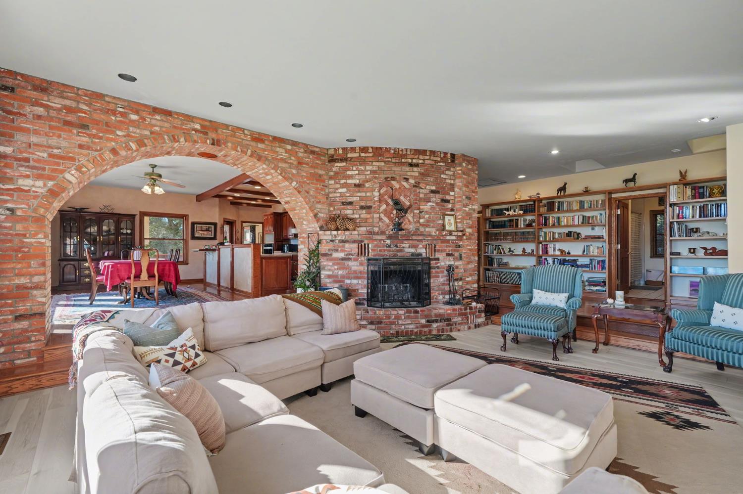 22707 Upton Road Plymouth, CA 95669 - Photo 26 of 99 a living room with furniture and a fireplace